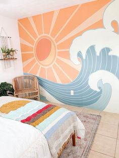 a bed room with a neatly made bed and a large mural on the wall behind it