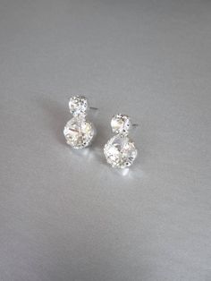 "These sparkly dainty stud earrings are made with fancy Swarovski crystals and come in gold, silver or rose gold finish. Post earrings with metal backs. - measurements : 5/8\" long and 3/8\" wide at the bottom" White Gold Rhinestone Earrings For Wedding, Cubic Zirconia Bridal Earrings With Rhinestones For Anniversary, Bridal Earrings With Rhinestones For Anniversary, Anniversary Bridal Earrings With Rhinestones And Cubic Zirconia, Anniversary Bridal Earrings With Rhinestones In Cubic Zirconia, Sterling Silver Bling Earrings For Wedding, Crystal Bridal Earrings With Bling For Anniversary, Wedding Diamond Crystal Earrings With Bling, Anniversary Bridal Earrings With Crystal Bling