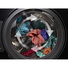 a washing machine filled with clothes and cloths