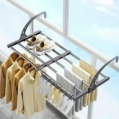 an over the door drying rack holds clothes and shoes