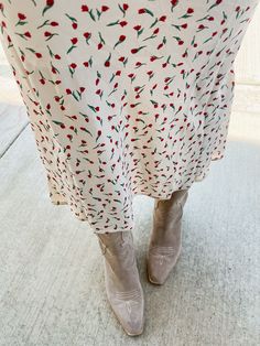 Put some flower power into your wardrobe with our Tammy Floral Midi Skirt! This ivory skirt features a red micro floral print and a comfortable elastic waistband. Perfect to pair with both graphic tees and sweaters, this midi skirt will add a playful touch to any outfit. Product Details: Measurements: WAIST small 13" medium 14" large 14.5" LENGTH small 34" medium 35" large 36" 100% polyester midi length elastic waist fully lined super comfortable model wearing size small model stats: size 4, 5'5 Casual Ditsy Floral Print Skirt, Red Skirt With Elastic Waistband For Spring, Cream Floral Print Bottoms For Spring, Spring Floral Print Cream Bottoms, Casual Midi Length Floral Print Bottoms, Casual Flowy Skirt With Ditsy Floral Print, Floral Print Midi Bottoms For Day Out, Floral Print Midi Length Bottoms For Day Out, Floral Print Midi-length Bottoms For Day Out