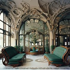 an ornately decorated living room with green couches and chairs in front of large windows