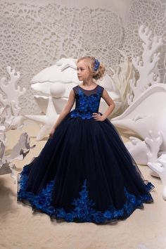 Elevate your little girl's style with our Fashion Couture Juliana Satin Tulle Girls Pageant Dress. This stunning gown is custom handmade with a 3D floral beaded applique design on the entire sleeveless bodice, giving it a unique and elegant touch. The floor-length layered tulle skirt with matching 3D floral beaded lace on the hem and back adds a dreamy and enchanting vibe to the dress. Perfect for special occasions, this dress comes with a hidden back zipper and corset tie for a secure and comfo Mini Quinceanera, Navy Blue Flower Girl Dresses, Elegant Flower Girl Dress, Blue Tulle Dress, Floral Tulle Dress, Flower Girl Dresses Blue, Girls Communion Dresses, Neck Flower, Cheap Flower Girl Dresses