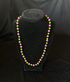 The pattern of this necklace is bubblegum pink and lime green beads.  Lightweight and cute. Green Large Beads Party Necklace, Green Large Beads Necklace For Party, Playful Pink Beaded Chain Jewelry, Playful Pink Jewelry With Beaded Chain, Green Large Beads For Party, Green Single Strand Jewelry For Party, Single Strand Green Jewelry For Party, Playful Pink Necklace With Colorful Beads, Green Beaded Necklaces With Round Beads For Party