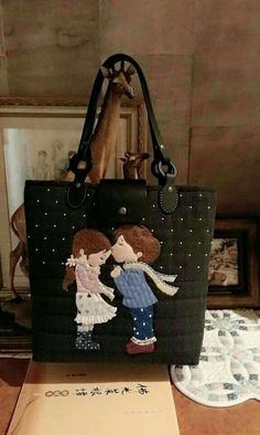 a handbag with an image of two people on it