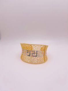 luxury in the making to elevate your wrist with this magnificent design. 40.90g Luxury Elegant 22k Gold Cuff Bracelet, Luxury Modern Gold-tone Cuff Bracelet, Luxury Gold-plated Cuff Bracelet With Polished Finish, Luxury Gold-tone Gold Plated Cuff Bracelet, Luxury Statement Gold-plated Cuff Bracelet, Cuff Bracelet, Two Tone, Cuff, Bracelet