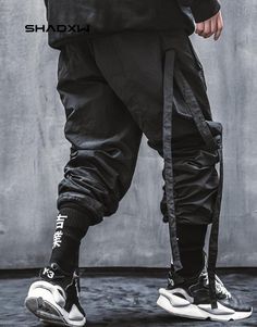 Black Streetwear Pants Hip Hop Parachute Pants For Winter Outdoor, Techwear Cargo Style Bottoms For Outdoor, Nylon Techwear Cargo Pants With Belt Loops, Winter Techwear Nylon Cargo Pants, Techwear Parachute Pants With Cargo Pockets, Techwear Parachute Trousers With Cargo Pockets, Hip Hop Cargo Pants For Outdoor, Combat Style Parachute Pants For Streetwear, Techwear Parachute Pants For Outdoor Activities