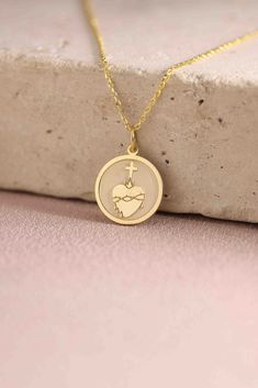 Gold Sacred Heart Pendant - Sacred Heart Gold Necklace ● Material of pendant: Solid Gold 14k ( REAL GOLD ) ● Metal Stamp: 14k ( REAL GOLD ) ● The pendant is available in 5 sizes: - 12,7 mm / 0.5 inches (Diameter) - 14,0 mm / 0,55 inches ( Diameter ) In the photos - 15,3 mm / 0.6 inches ( Diameter ) - 16,5 mm / 0,65 inches ( Diameter ) - 19,1 mm / 0,75 inches ( Diameter ) ( In the photos the size is 14mm / 0.55 inches Diameter ) ( Jump Ring inner diameter: 4 mm ) ● Material of chain: Solid gold 1 14k Gold Necklace For Valentine's Day, Symbolic Heart Shaped White Gold Jewelry, 14k Gold Heart Necklace Tarnish Resistant For Gift, 14k Gold Tarnish-resistant Heart Necklace Gift, Symbolic Yellow Gold Heart Jewelry, 14k Gold Round Pendant Charm Necklace For Valentine's Day, Symbolic Necklace With Heart Charm For Anniversary, Symbolic Heart Charm Necklace For Anniversary, Symbolic Gold Jewelry For Valentine's Day