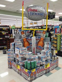 a display in a grocery store filled with sodas and soft drinks for the holiday season