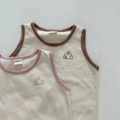 Ready for summer fun 🌞? Dress your little one in our Kids Tank & Shorts Summer Set and watch them conquer the day with comfort and style! Tailored for children aged 1-6 years, this unisex set is a blend of cool and casual. Crafted from breathable cotton, it's perfect for those warm, playful days. With a solid pattern that effortlessly matches any accessory, this O-neck tank top and shorts combo slips on easily, thanks to a handy pullover closure – no fuss involved! The sleeveless design ensures your kiddo stays breezy and free during their adventures. Specifications: Age Range: 1-6 years Season: Summer Material: Cotton Pattern Type: Solid Gender: Unisex Item Type: Set Department Name: Children Collar: O-Neck Closure Type: Pullover Sleeve Style: Regular Sleeve Length: Sleeveless Fit: Fits Tank Top And Shorts, Romper Outfit, Girls Blouse, Suit Up, Shorts Summer, Summer Set, Jogger Set, Boys Top, Summer Baby