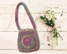 Say hello to autumn with our stylishly chic crochet bag, oozing boho-hippie vibes. This trendy little number is surprisingly spacious, perfect for your phone, wallet, and all those other can't-leave-home-without accessories. With its charming blend of earthy autumn shades and vintage sunburst granny squares, this bag adds a dash of whimsy to your outfit. Fancy a unique gift for someone special? This crochet gem is a winner! Not just pretty, it's practical too! Machine washable and ideal for dail Trendy Rectangular Shoulder Bag For Festivals, Trendy Festival Crossbody Bags, Handmade Shoulder Bag For Spring, Bohemian Crochet Bag For Daily Spring Use, Handmade Spring Shoulder Bag, Pink Bohemian Crochet Bag With Adjustable Strap, Summer Festival Crossbody Bags, Vintage Summer Bags For Festivals, Pink Bohemian Crochet Shoulder Bag