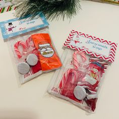 two packaged candy canes sitting on top of a table