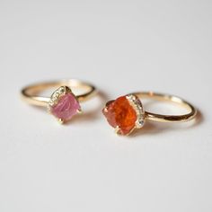 Bright, bold, and undeniably unique, the Gee Spessartine Garnet Solitaire Ring brings rich color and refined craftsmanship to your collection. The stunning 3.88 CTW Tenda cut Spessartine Garnet takes center stage, complemented by sand pave accents and natural diamonds (0.06 carats) set in 18k recycled yellow gold. Part of Debra Navarro’s Watu Collection, this one-of-a-kind piece is inspired by the vibrant landscapes of East Africa. Material: 18k recycled yellow gold Gemstones: Tenda cut Spessart Spessartine Garnet, Rough Hands, African Travel, East Africa, Garnet Rings, Engagement Ring Wedding Band, Recycled Gold, Center Stage, Wedding Trends