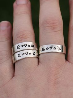 "Are both you and your partner or best friend into astrology? Connect the two of you with this Zodiac ring that features both of your Zodiac signs with a heart and stars in between. Your choice of Zodiac signs! DETAILS: -Each ring is hand stamped -Ring is Sterling Silver -6mm in thickness You will receive one hand-stamped ring filled with a black enamel finish. **Every item is handmade, this means that each will be unique and may not look EXACTLY like the picture, but it will look very similar ➡ORDER PROBLEMS If there are any problems with your order please contact me, my goal is for you to be happy with your products and I will do what I can to help! ➡BULK ORDERS I gladly make bulk orders! For every bulk order of 15+, there is a special discount. The more you order, the more you save! Mes Personalized Sterling Silver Rings For Friendship, Personalized Silver Friendship Rings, Sterling Silver Friendship Ring, Adjustable Personalized Rings For Friendship, Personalized Adjustable Rings For Friendship, Symbolic Adjustable Stackable Rings For Anniversary, Adjustable Symbolic Promise Rings, Symbolic Adjustable Rings For Anniversary, Adjustable Symbolic Personalized Rings