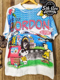 #nascar #JeffGordon #Peanuts #Snoopy #racing #tee #tshirt #streetwear #vintagereprint #alloverprinttshirt #vintaget #alloverprint #aop Vintage Cotton T-shirt With All Over Print, Cotton Sublimation Streetwear With Printed Design, Cotton Sublimation Printed Streetwear, Pop Culture Short Sleeve Sublimation T-shirt, Pop Culture Sublimation Short Sleeve With Graphic Print, Pop Culture Short Sleeve Sublimation T-shirt With Graphic Print, Pop Culture Short Sleeve Sublimation Design With Graphic Print, White Cotton Sublimation Design With All Over Print, Vintage Cotton Top With All Over Print