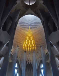 the inside of a building with many windows and lights on it's ceiling,