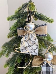 a christmas tree decorated with burlocks and bows