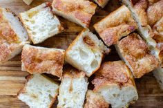 slices of french toast sitting on top of a wooden cutting board