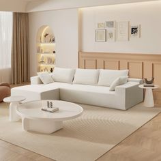 a modern living room with white furniture and wood flooring