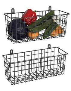 two metal baskets filled with vegetables on top of each other