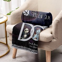 a chair with a blanket on it that says, me and you the same person