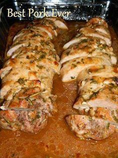 the meat is covered in sauce and garnished with herbs