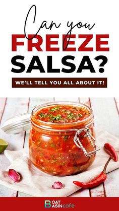 a jar filled with salsa sitting on top of a table