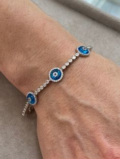 Silver Evil Eye Bracelet , Blue Stone Bracelet , Handmade Jewelry Bracelet , Good Luck Bracelet , 925K Sterling Silver Jewelry ,Gift For Him .. ★Item Details * Material : 925K Sterling Silver * Total weight : 10 Grams * Length : 18 Cm ✔ Ready to Ship in 1-2 Business Days .. ✔ Shipped to the Worldwide 1-5 business days with free shipping... ✔ The product will be sent to you with a handmade wooden box to avoid any damage during shipping... ✔ Visit our store, browse other Men's jewelry, silver and Hand Set Blue Diamond Bracelet As Gift, Blue Hand Set Diamond Bracelet As Gift, Blue Jubilee Bracelet Jewelry, Blue Sterling Silver Bracelets, Adjustable Sterling Silver Tennis Bracelet Bangle, Blue Sterling Silver Round Bracelets, Blue Hand-set Tennis Bracelet As Gift, Blue Hand-set Tennis Bracelet For Gift, Blue Sterling Silver Jubilee Bracelet Gift