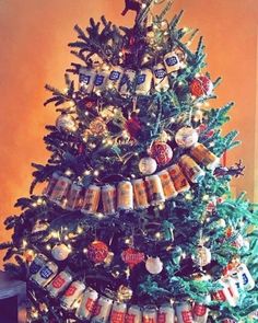 a decorated christmas tree with beer cans on it