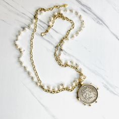 La Victoire Large Coin Pendant with Gold Chain and Freshwater Pearl Necklace — fickle fox co Gold Ball Chain, Vintage Pendant Necklace, Gold Link Chain, Coin Pendant Necklace, Semi Precious Gems, Ball Chain Necklace, Gold Heart Necklace, Freshwater Pearl Necklace, Silver Coin