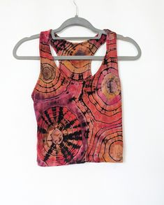 One-of-a-kind reverse tie dye tank top. Fabric is 95% cotton, 5% spandex and is comfortable and stretchy. Size large (women's sizing), cropped fit (18.5 inches long). Shirt has been upcycled (thrifted and then dyed) and has been washed in a light concentration of industrial detergent for maximum color retention. Color palette: sunset Note: I recommend washing all tie dye clothing COLD to ensure that colors stay vibrant over time. Tie Dye Clothing, Hippie Clothing, Reverse Tie Dye, Tie Dye Outfits, Tie Dye Tank Top, Tie And Dye, Hippie Outfits, Top Fabric, Long Shirt