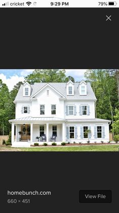 a white house with black shutters on the front and side windows is featured in this real estate listing