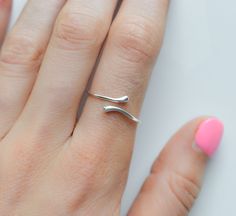 Introducing our stunning sterling silver bypass ring, perfect for everyday wear. This adjustable thumb ring for women features an open wrap design that can also be worn as an adjustable ring, making it versatile and comfortable. Our dainty ring is a must-have addition to any jewelry collection. Rings are only sold in sizes 5 6 7 8 9 10  PRODUCT DETAILS * Ring is solid 925 sterling silver * Width of band measures 2mm  * Comes beautifully packaged in a gift box SHIPPING and POLICIES * Orders are m Hypoallergenic Open Band Midi Rings, Minimalist Bypass Toe Ring, Minimalist Bypass Toe Ring For Gift, Modern Twist Open Band Midi Rings As Gift, Gift Midi Rings Open Ring Modern Twist, Modern Sterling Silver Bypass Ring As Gift, Modern Sterling Silver Bypass Ring For Gift, Minimalist Silver Bypass Ring With Open Band, Sterling Silver Bypass Ring With Modern Twist For Gift