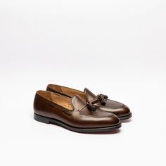 Dark brown burnished calf tassel loafer with single leather sole. Fitting E, last 325. Made in England Crockett And Jones, Tassel Loafers, Boat Shoes, Dark Brown, Tassels, England, Loafers, Leather