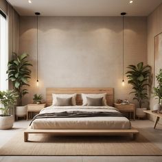 a large bed sitting in the middle of a bedroom next to two tables and potted plants