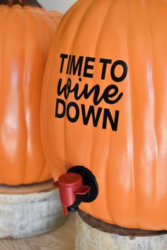 two pumpkins with time to wine down written on them