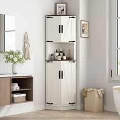 a white toilet sitting next to a bath tub in a bathroom