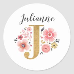 a round sticker with the letter j in gold glitter and pink flowers on it