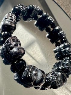 Good quality hypersthene beads in carved pixu 14x10mm with 6mm+ black tourmaline beads. It fits a 16cm wrist. Hypersthene is said to calm, soothe, and quiet. It's especially helpful when the mind is overactive. Some believe that hypersthene has a grounding effect, helping to calm the mind and soothe turbulent emotions. It's also associated with strengthening personal will and power, aiding in realizing one's potential.  Hypersthene has been the Birthstone Jewelry for Aries, Leo, and Sagittarius for a long time. Healing Properties of Black Tourmaline Black Tourmaline is renowned for its remarkable healing properties. It is believed to possess strong protective energies that shield individuals from negative influences and psychic attacks. It is often used as a grounding stone, helping to sta Psychic Attacks, Leo And Sagittarius, Aries Leo, Positive Influence, Psychic Attack, Body Energy, Emotional Wellbeing, Power Crystals, Tourmaline Beads