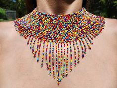 These magical Huichol necklaces are meticulously handbeaded holding true to ancient tradition. The mesmerizing geometric patterns and intricate beadwork create beautiful works of art. Each piece is uniquely created making them a perfect gift for those who truly appreciate authentic cultural jewelry. *Some pieces can vary in color depending on lighting in some photos. Please feel free to message us if you have any questions or would like to see the jewelry in a different setting* Artisan Festival Beaded Necklaces, Unique Beaded Necklaces For Festivals, Traditional Beaded Necklace For Crafting, Artisan Bib Necklaces With Round Beads For Festivals, Festival Bib Necklaces With Polished Round Beads, Unique Beaded Necklaces With Round Beads For Festivals, Unique Beaded Necklaces With Tiny Beads For Festivals, Unique Beaded Necklace With Tiny Beads For Festivals, Unique Tiny Beads Necklace For Festival