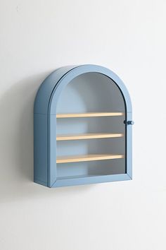 a blue wall mounted shelf with two shelves on each side and an opening in the middle