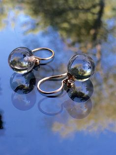 "Little POOLS OF LIGHT Dangle Earrings 12mm Round Clear Genuine Rock Crystal Quartz Drops / 14K Gold Filled Bead Caps Hand forged 14K Gold Filled NICKEL FREE* Ear Wires LARGER 14mm Version of the same earrings: https://www.etsy.com/listing/1075602186/floating-pools-of-light-14mm-genuine?ref=shop_home_active_1&frs=1&sca=1 CHECK OUT THE MATCHING ORB PENDANT NECKLACE: https://www.etsy.com/listing/654718365/pools-of-light-14mm-rock-crystal-quartz?ref=shop_home_active_1 *ALL METAL I USE ON AN Hypoallergenic Round Bead Jewelry For Formal Occasions, Formal Hypoallergenic Jewelry With Round Beads, Hypoallergenic Formal Jewelry With Round Beads, Handmade Elegant Spherical Jewelry, Clear Round Wedding Earrings, Adjustable Round Clear Jewelry, Adjustable Clear Jewelry, Hypoallergenic Clear Jewelry For Wedding, Hypoallergenic Round Clear Jewelry