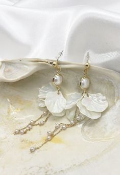 Who said that luxurious earrings can only be formal evening? Try on these delicate pearls that do not oblige you to choose special clothes but despite their seeming simplicity will add sophistication, gloss and attract attention to you! Material: Freshwater Pearl; Mother of Pearl; Gold Plated. Length: 3.5 inch. Mentally Disturbed, Luxurious Earrings, Negative Attitude, Pearl Flowers, Emotionally Unavailable, Special Clothes, Luxury Earrings, Funky Jewelry, Wedding Jewelry Earrings