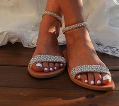 These beautiful bridal sandals are definitely one of our best models with an elegant embroidered finish with pearls and beads that are sewn by hand on leather straps Full sizes only ** If you have half the size, go UP to the nearest full size. ** If you are unsure of your size, please contact me so I can assist you. Check out our other wedding sandals here: MORE WEDDING SANDALS: https://www.etsy.com/listing/932339383/wedding-sandals-lace-wedding-shoes-beach?ref=shop_home_feat_4&pro=1&frs Bridal Shower Pearl Embellished Ankle Strap Sandals, Elegant Beaded Wedding Sandals, White Beaded Sandals For Wedding, Beaded Open Toe Sandals For Wedding, White Beaded Wedding Sandals, Summer Open Toe Pearl Wedding Shoes, Summer Wedding Pearl Open Toe Shoes, Summer Wedding Embellished Sandals, Embellished Wedding Sandals With Open Toe