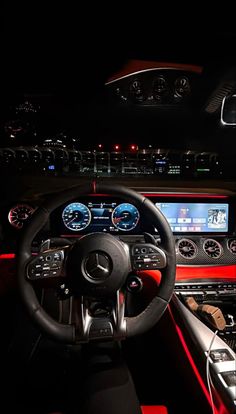 the interior of a modern car at night