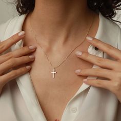 Showcase your faith with our Cross Pendant Necklace. The perfect gift for confirmation, christening, or any special occasion. Made for women who want to make a statement of their belief in a stylish and elegant way. Get one for yourself or a loved one today! Pendant width: 10 Millimeters; Pendant height: 16 Millimeters Please note that we also offer matching Cross Bracelet in our shop! Elegant Clavicle Chain Cross Necklace For Gift, Elegant Crucifix Cross Necklace, Elegant Rose Gold Sterling Silver Cross Necklace, Elegant Cross Necklace With Delicate Chain For Gift, Elegant Crucifix Jewelry With Delicate Chain, Elegant 14k Gold Cross Necklace With Delicate Chain, White 14k Gold Cross Necklace Gift, White 14k Gold Cross Necklace As Gift, 14k Gold White Cross Necklace As Gift