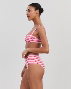 The Lilo Ribbed Bikini Bottom is the perfect retro-inspired swimsuit in a new ribbed fabrication. This high-waisted silhouette offers moderate coverage. Pair it with the matching top and Oxford Tunic to complete your look. Fitted Striped Bra-friendly Swimwear, Fitted Ribbed Triangle Top Swimwear, Ribbed Beachwear Swimwear, Ribbed Beachwear Swimwear For Swimming, Striped Seamless Fitted Swimwear, Striped Fitted Seamless Swimwear, Retro High Waist Swimwear For Pool, Fitted Striped Seamless Swimwear, Retro High-waist Swimwear For Pool