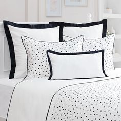 black and white bedding with polka dots on it