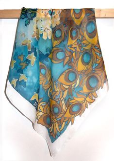 Square scarf Peacock Feather is hand painted with art nouveau pattern of flowers and peacock feathers, in vivid blue & gold color composition. Size: 22 by 22 in (55 by 55 cm) 34 by 34 in (88 by 88 cm) Silk: natural Habotai Light (semi - transparent, very delicate and light, a bit glossy) This silk scarf is made to order and I will need 3 days for painting. The Peacock Feather scarf was designed by me as an Art Nouveau woman accessory! Please note that I don't track my designs, so the scarf f Bohemian Blue Silk Scarf Gift, Bohemian Blue Silk Scarf For Gift, Bohemian Blue Silk Scarf As Gift, Artsy Blue Silk Scarf As Gift, Artsy Blue Silk Scarf Gift, Painted Silk Scarves, Motifs Art Nouveau, Feather Scarf, Art Nouveau Pattern