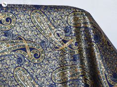 Indian Blue Brocade by the Yard Banarasi Wedding Dresses Material Sewing Lehenga Skirt Men Vests Jackets Costumes Curtain Upholstery craft. This is a beautiful multi color banarasi brocade in floral design fabric in multi color (Blue with Yellow, Green, Black) and Gold. ➤Product: Brocade Fabric ➤Fabric Type: Blended Silk (Viscose + Rayon and 30% Silk) Fine quality Zari Brocade Weaving from Banaras ➤Color: Base color is Blue with Yellow, Green, Black and Gold ➤Width: 42 inches. ➤Condition: New ➤ Blue Brocade Fabric For Wedding, Blue Silk Fabric For Wedding, Elegant Blue Fabric For Festive Season, Elegant Blue Fabric For Festive Occasion, Elegant Festive Blue Fabric, Blue Fabric With Traditional Patterns For Weddings, Blue Fabric For Wedding And Festivals, Blue Traditional Wedding Fabric, Blue Wedding Fabric With Pallu